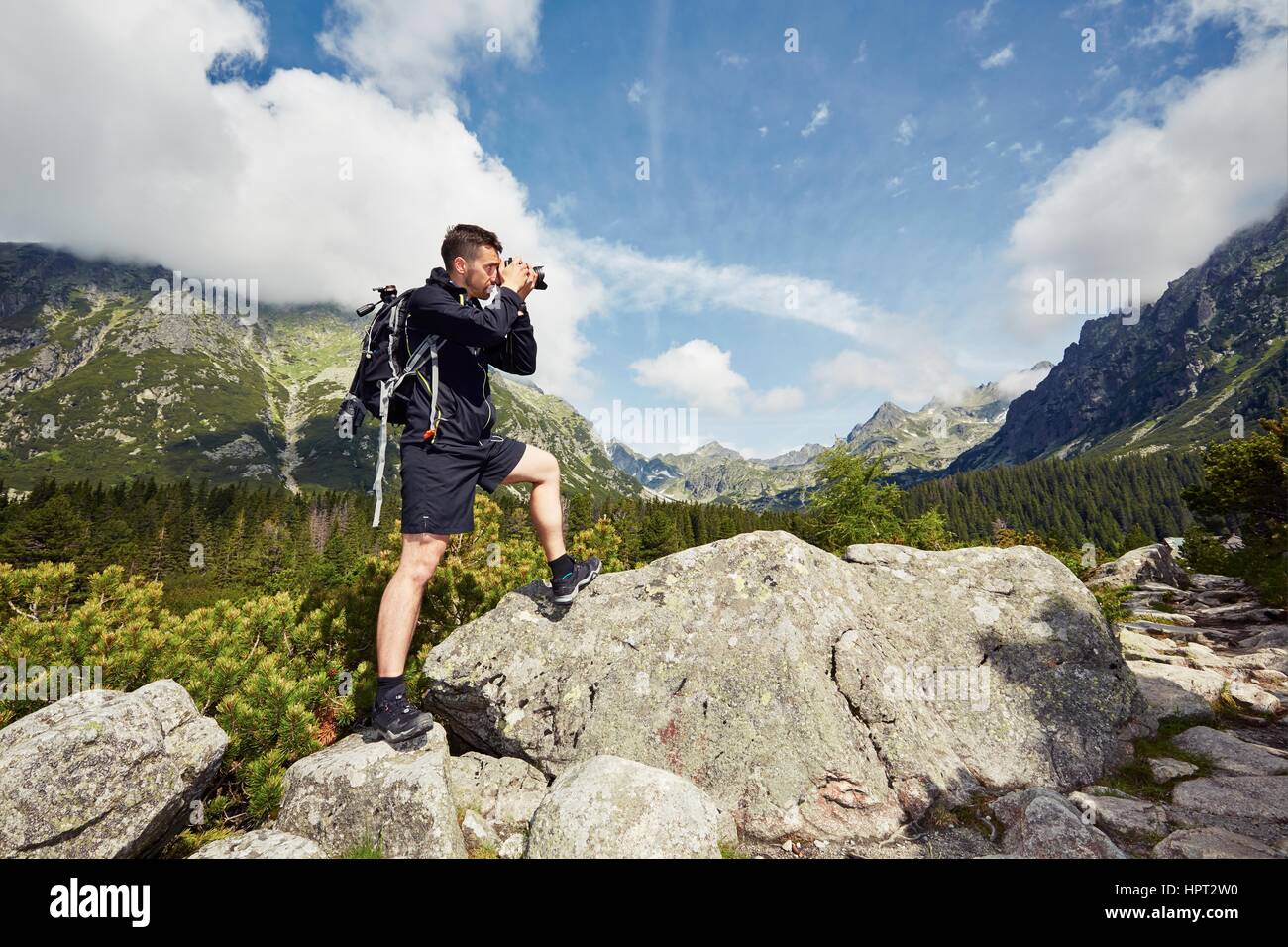 Trip of young photographer in the mountains Stock Photo