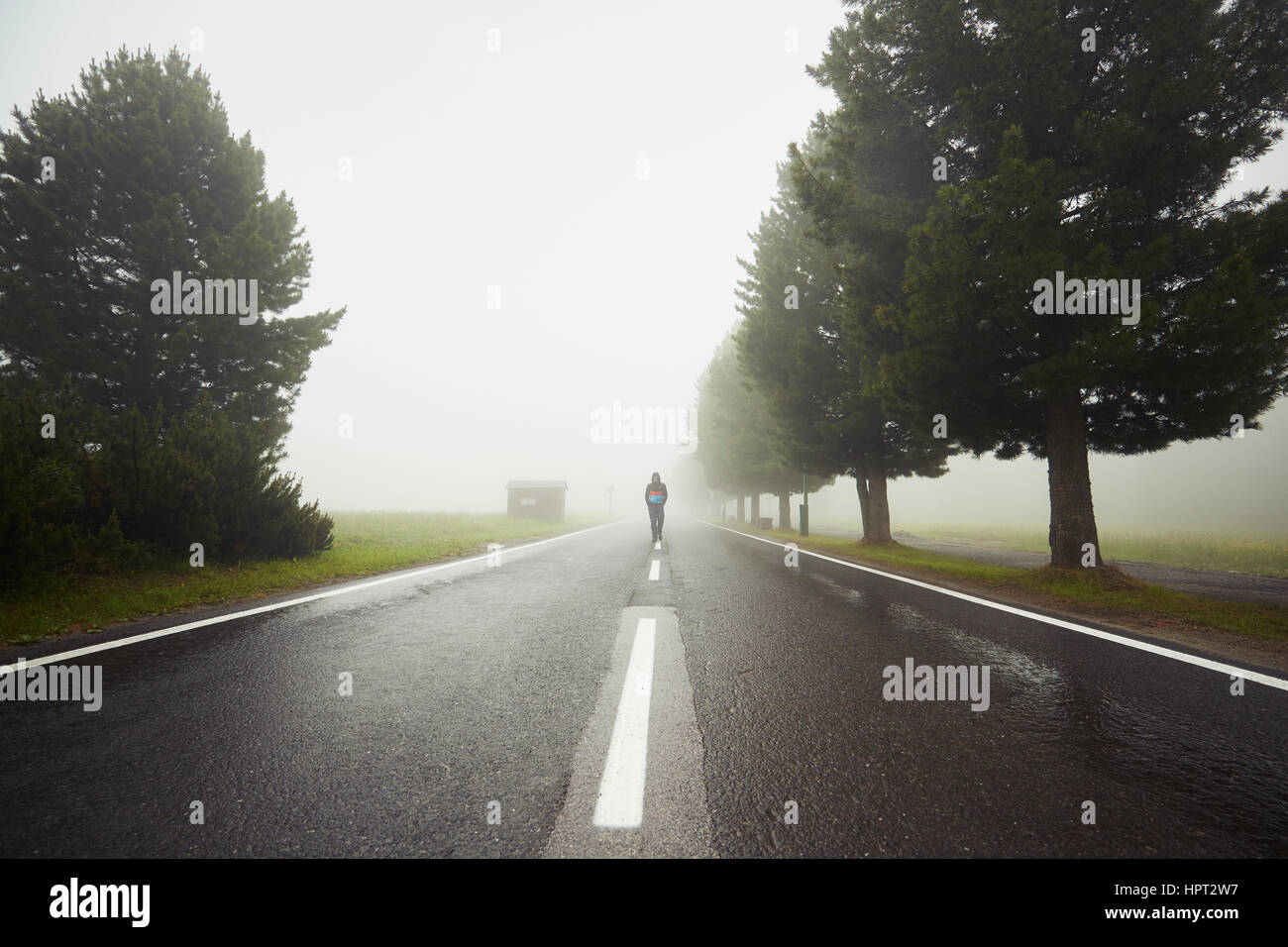 Man walking lonely road hi-res stock photography and images - Alamy
