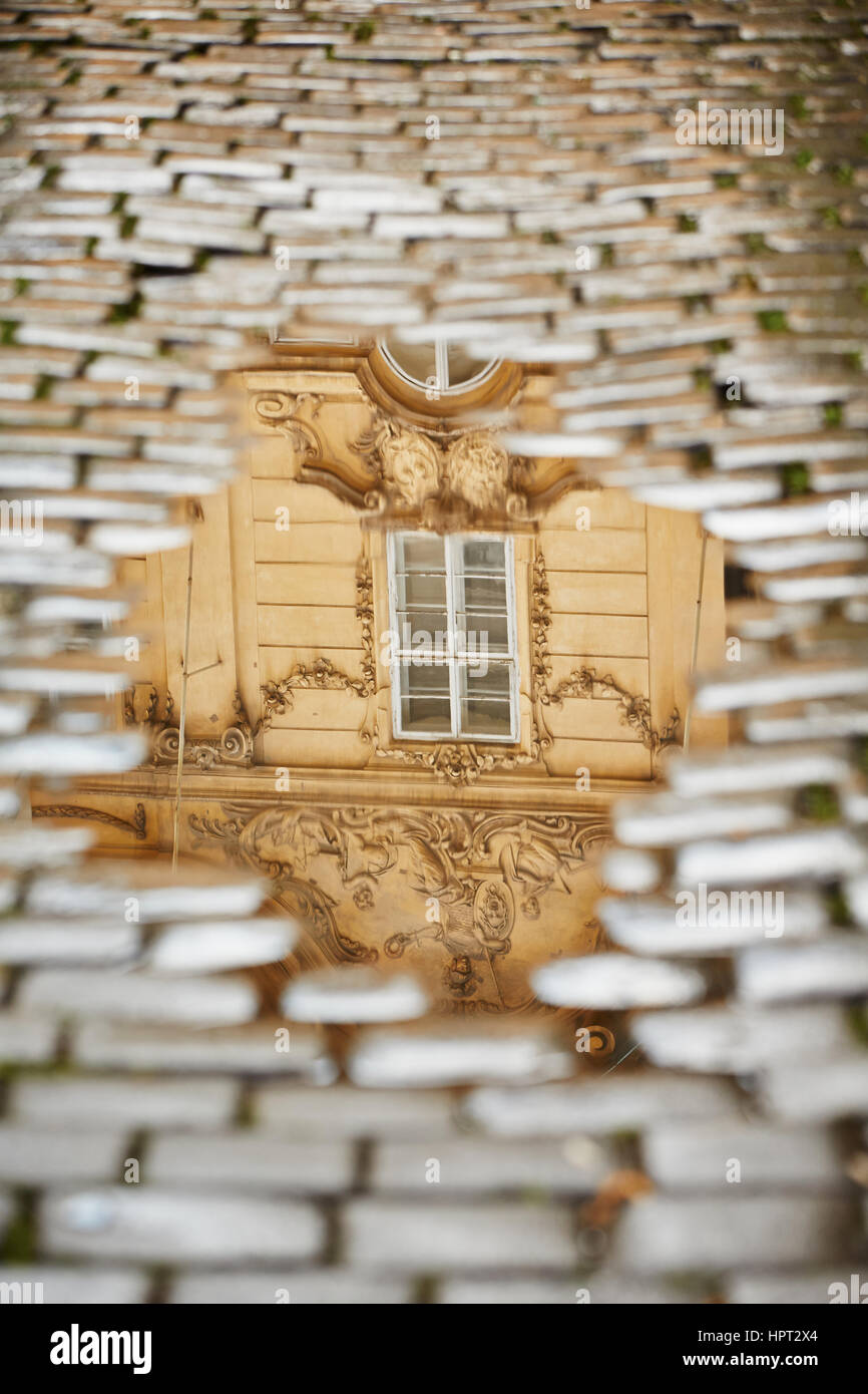 After rain in Prague - reflection of the house in puddle Stock Photo