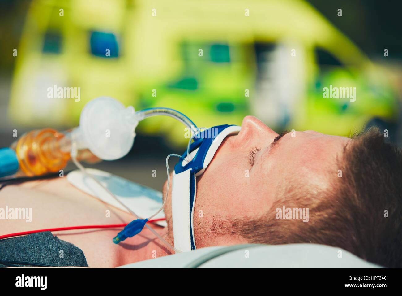 Paramedic preparing the patient after resuscitation for transport to the hospital. Stock Photo