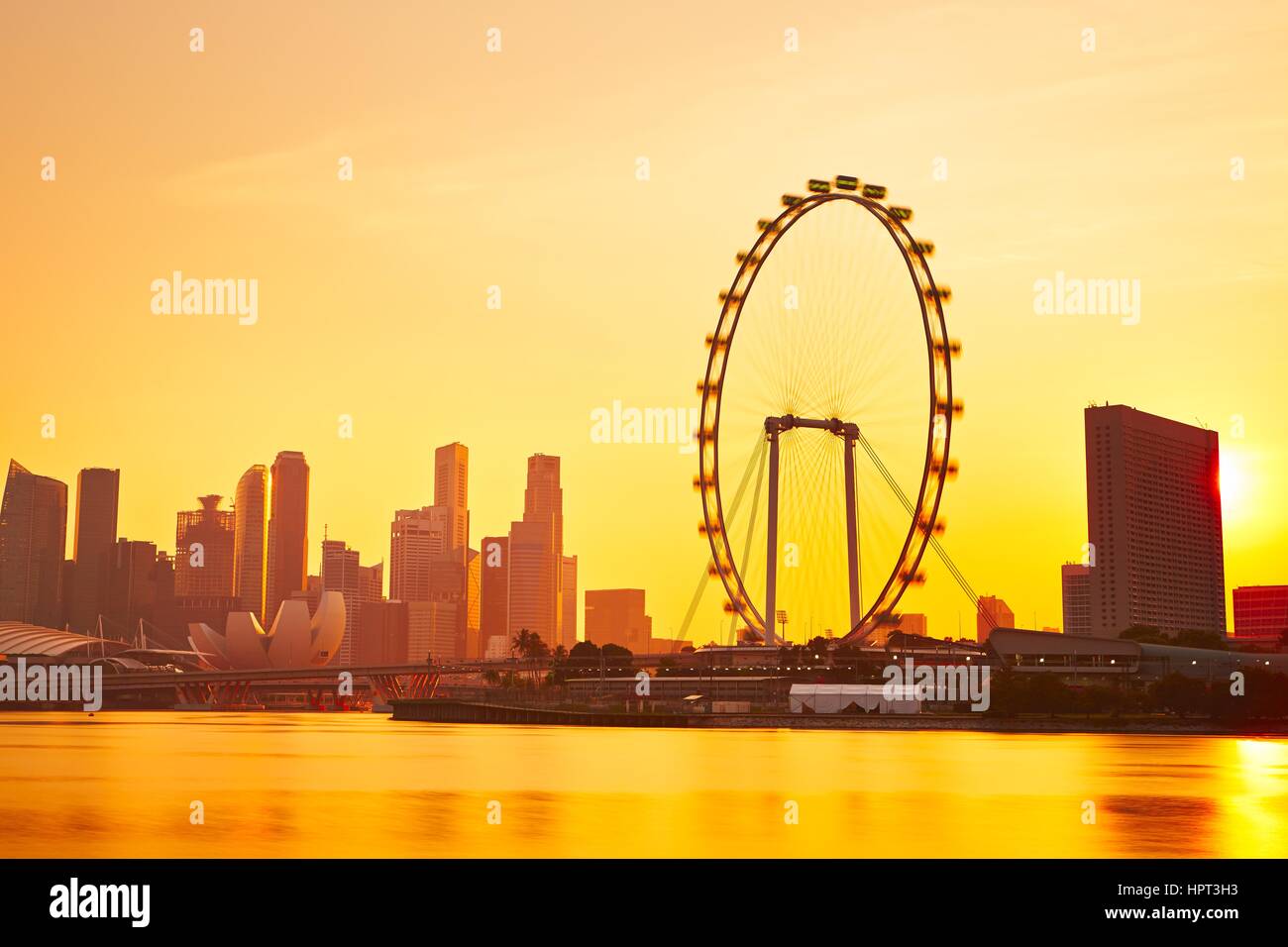 Skyline of Singapore at the golden sunset Stock Photo