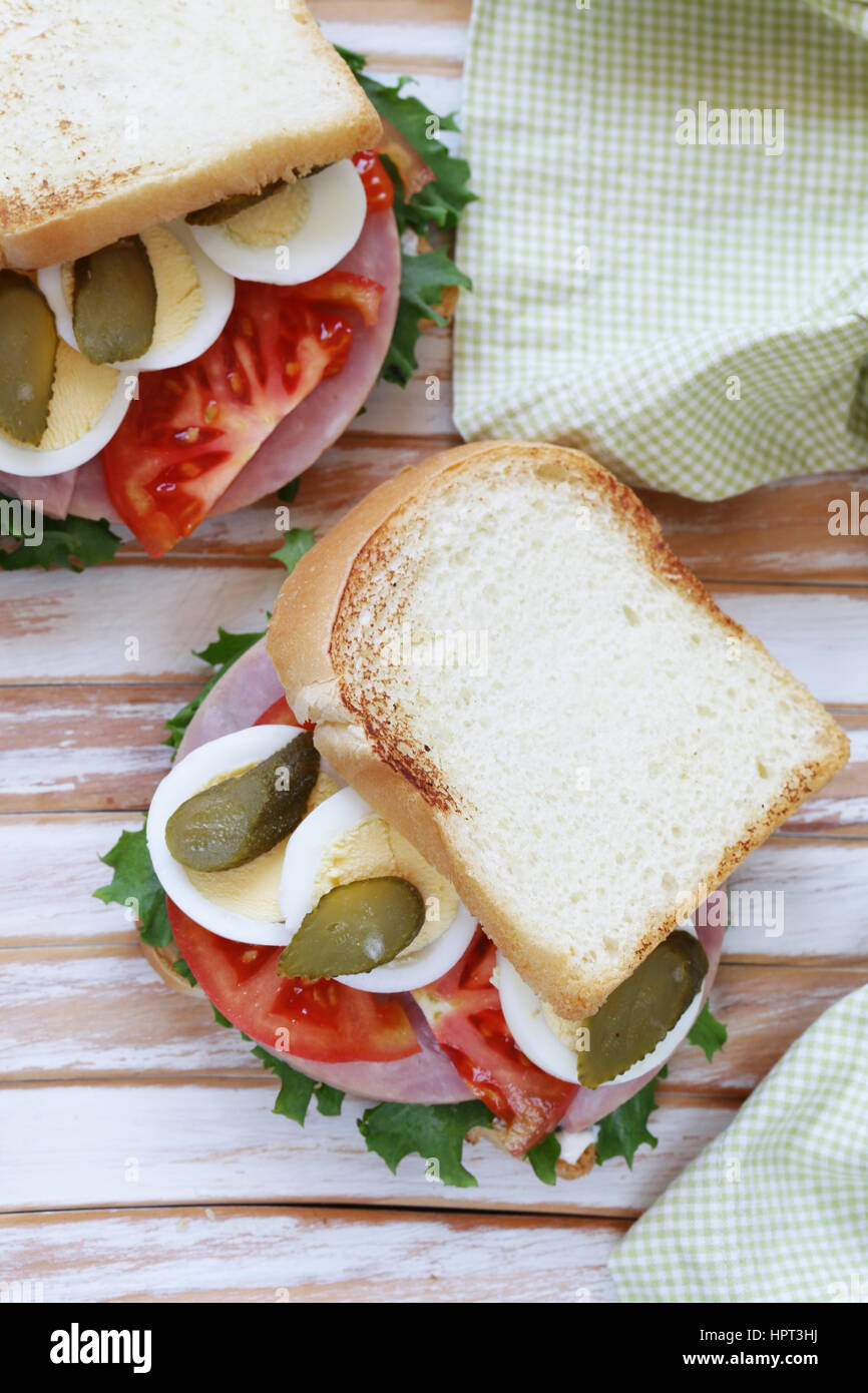 Samich sandwich with ham, tomato, egg and pickles Stock Photo - Alamy