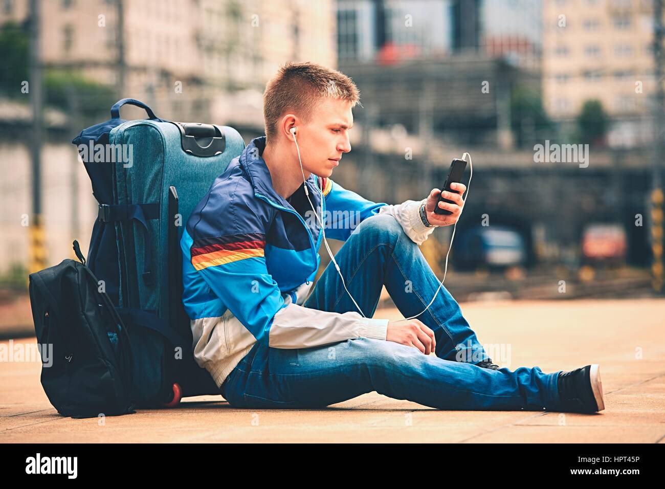 Young traveler is waiting at the railway station Stock Photo