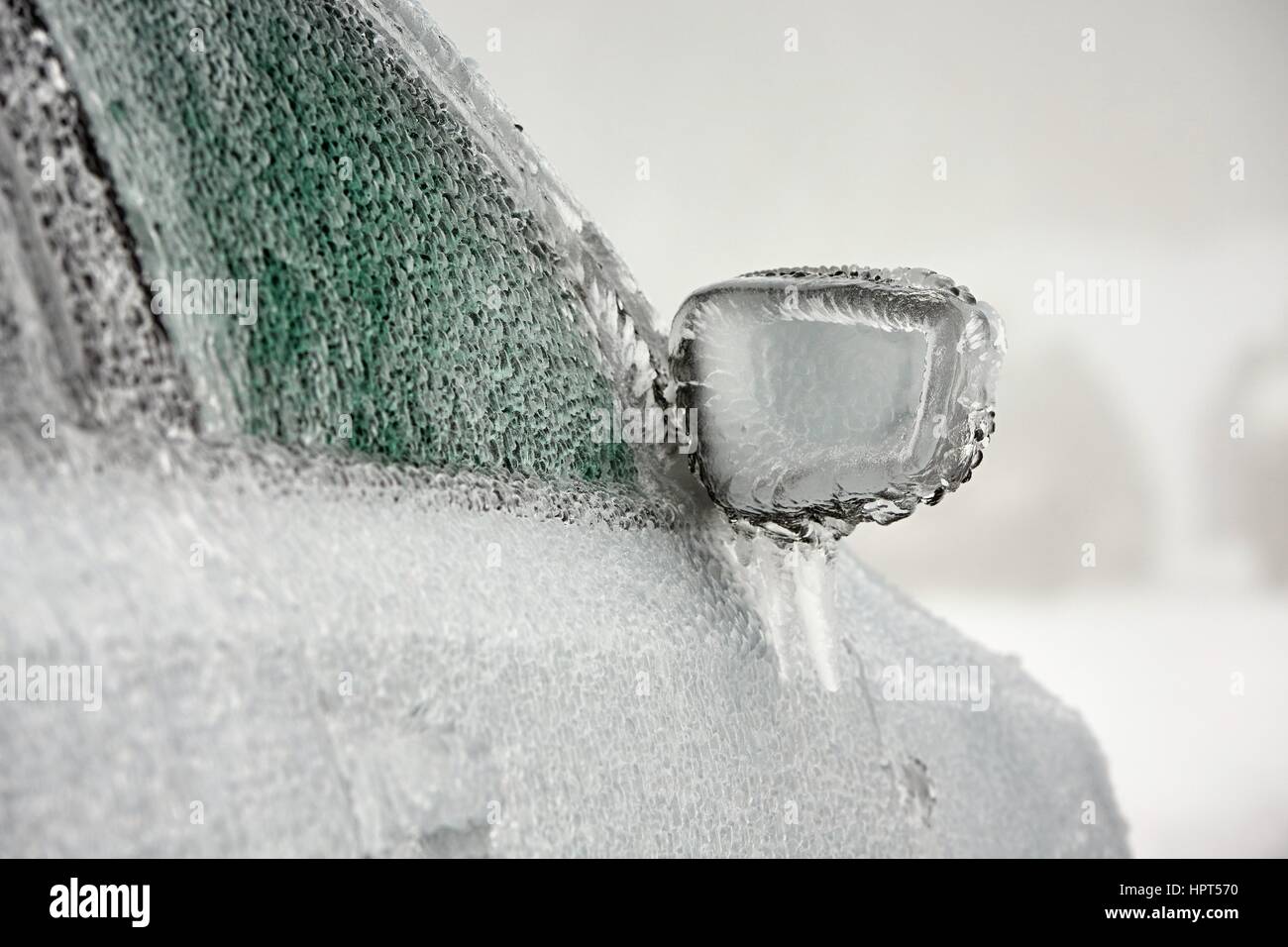 Car on the street covered by icy rain. Stock Photo