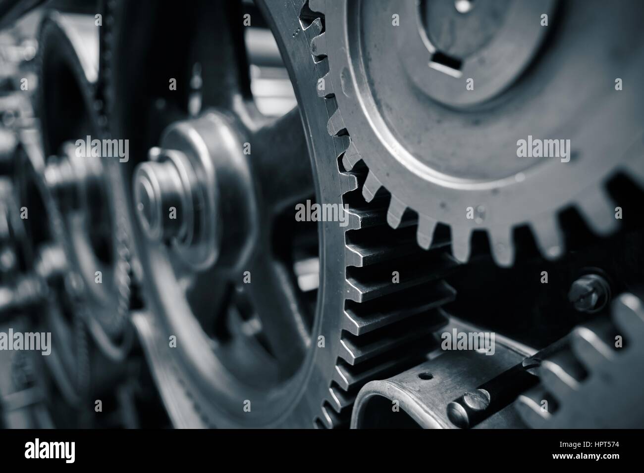 Large cog wheels in the motor - blue toned Stock Photo