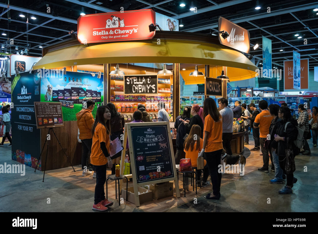 Customers buying pet food at expo booths at Hong Kong Pet Show