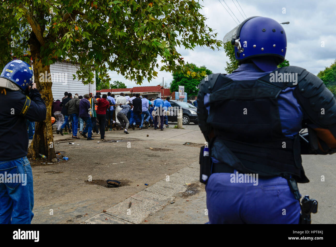 Pretoria, South Africa. 24th Feb, 2017. Policemen shoot rubber bullets