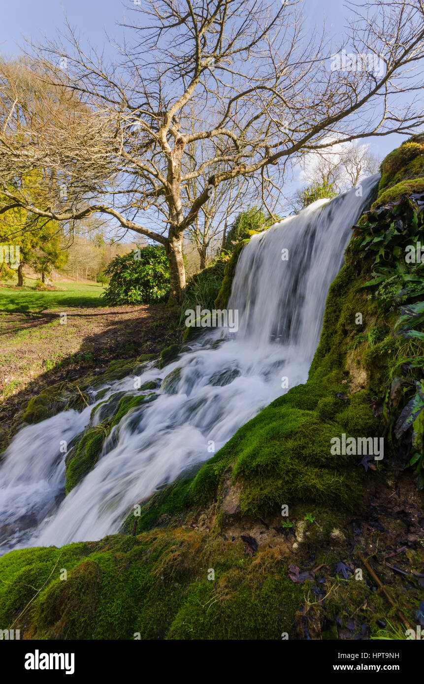 Littlebredy, Dorset, UK. 24th Feb, 2017. UK Weather. Glorious afternoon sunshine at Bridehead House Garden waterfall at Littlebredy in Dorset. Bridehead House Gardens at Littlebredy is the fictional location of Axehampton House which features in series 3 of the ITV hit series Broadchurch which returns to our screens on Monday 27th February. Credit: Graham Hunt/Alamy Live News Stock Photo