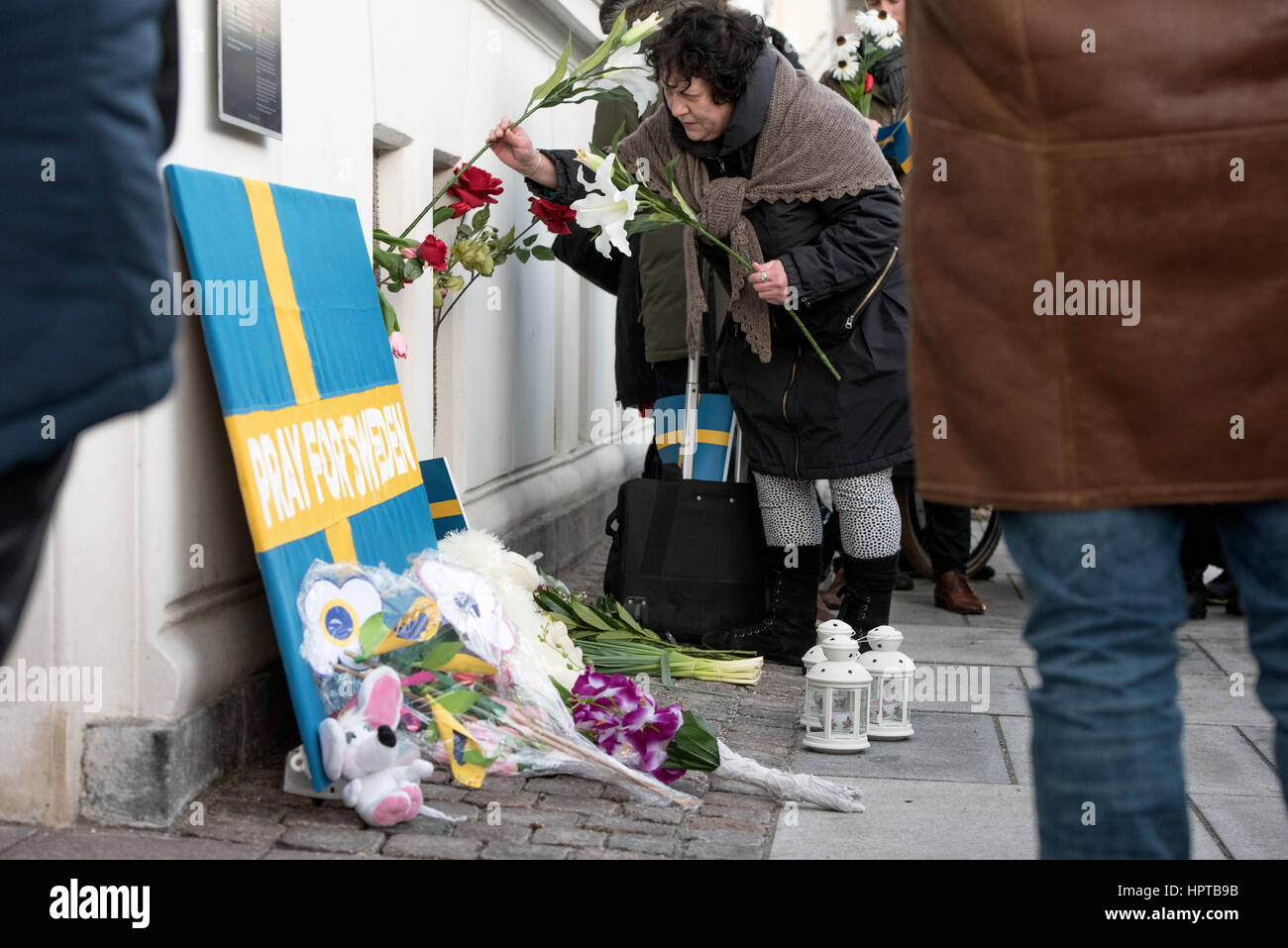 An estimated 100 people gathered outside the Swedish Embassy in Copenhagen for a mock memorial to show solidarity over an event that never happened.   Last week US president Donald Trump said, 'Look at what happened last night in Sweden,' during a speech condemning Muslim immigration to western countries.   Baffled Swedes argued that the evening in question was uneventful. To highlight the mistake, Danish artist Artpusher organised a mock memorial. He said, ”Following the terrible attack on our sister country Sweden, reported by US president Trump, the Nordic countries must stand United.' Stock Photo
