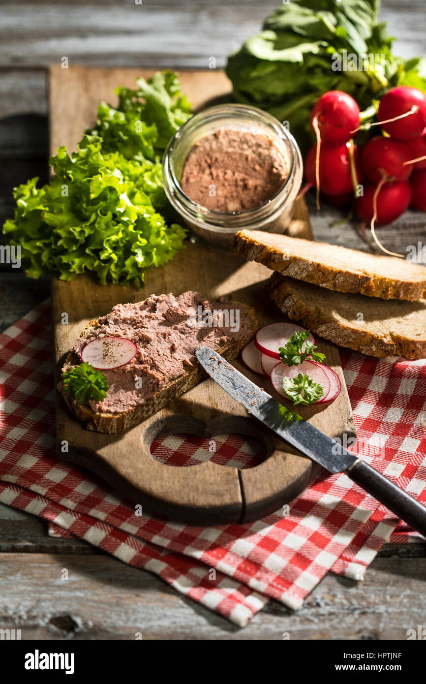 Liverwurst spread on slice of brown bread Stock Photo Alamy