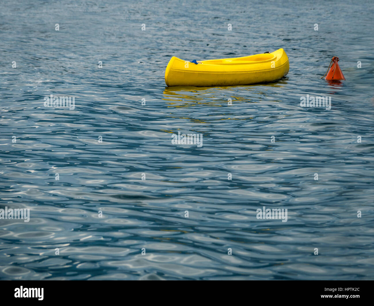 Italy, Sicily, yellow boat anchoring on the sea Stock Photo