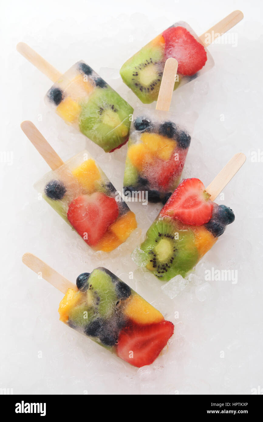 Six fruit ice lollies with fresh fruits on white ground Stock Photo Alamy