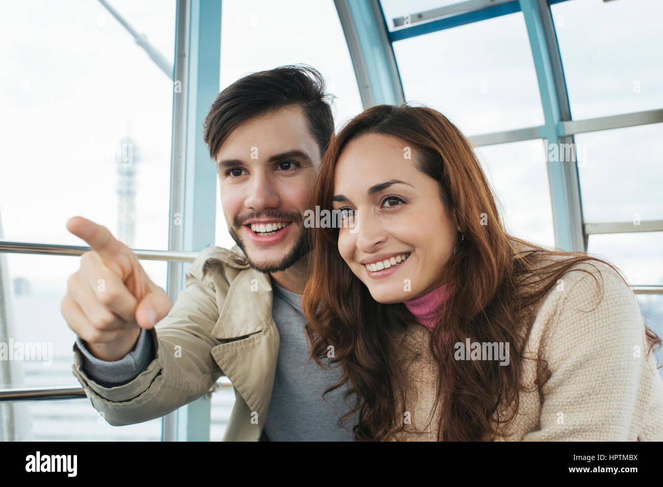 Portrait of couple watching something Stock Photo