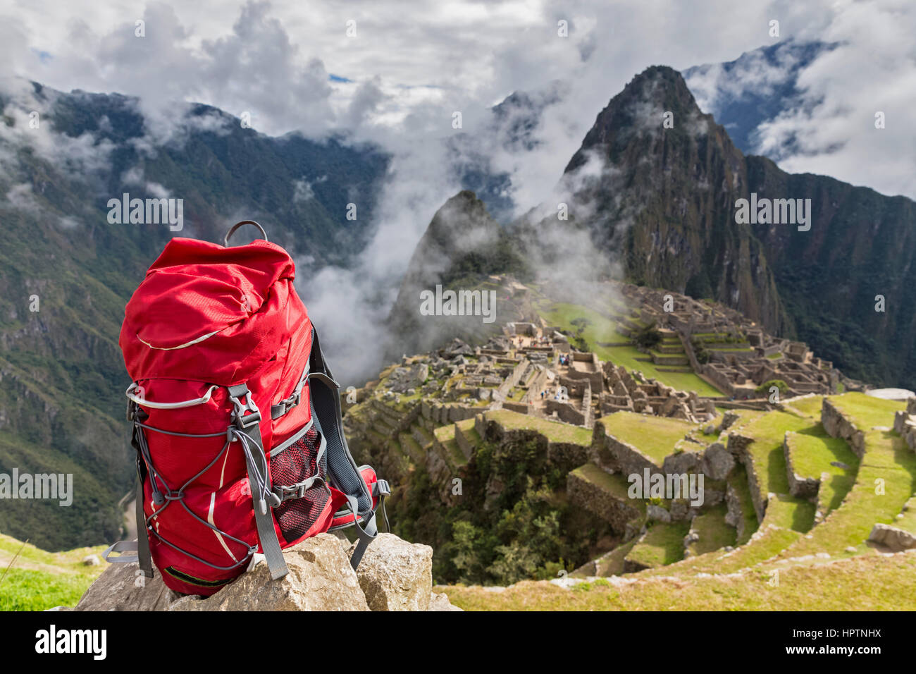 Peru, Andes, Urubamba Valley, red backpack at Machu Picchu with