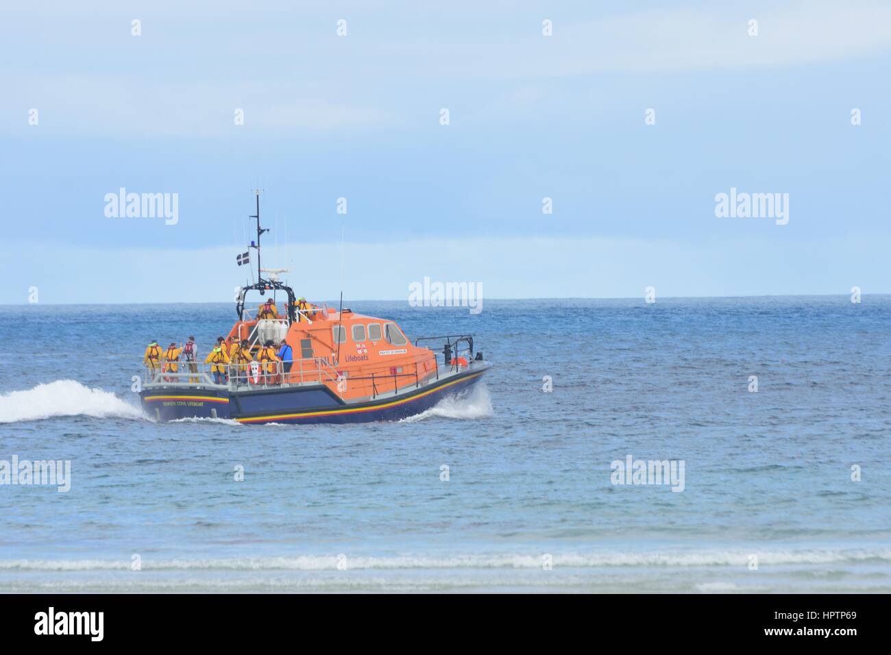 Sennen Cove Cornwall , United Kingdom - July 02, 2016:  RNLI lifeboat heading out to sea Stock Photo