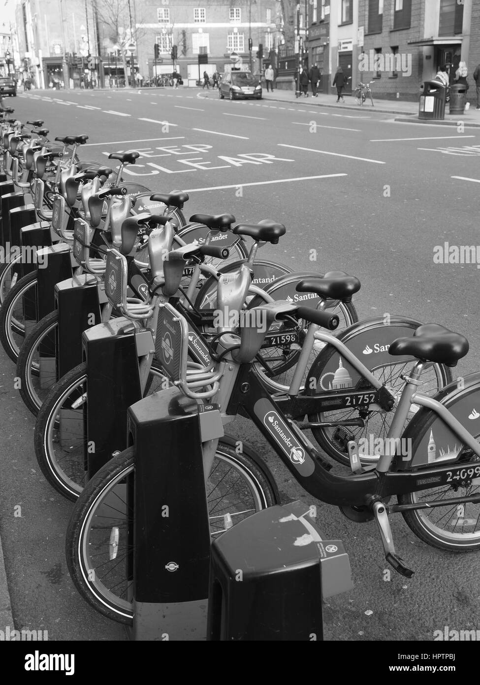 Boris bikes, cycles for hire rental in docking bay, Stock Photo