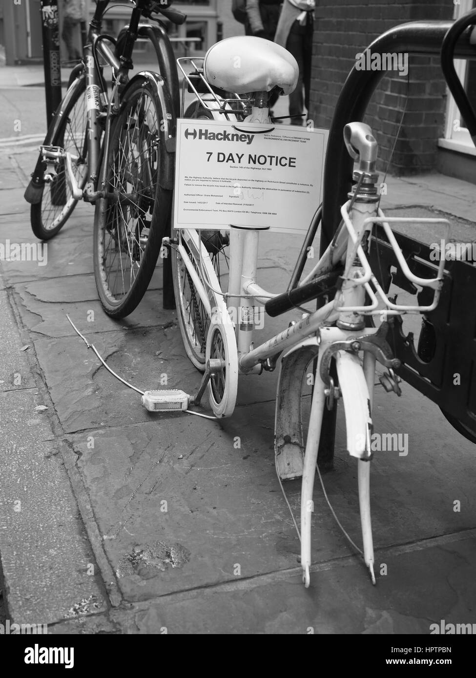Bicycle with wheel missing and penalty notice Stock Photo