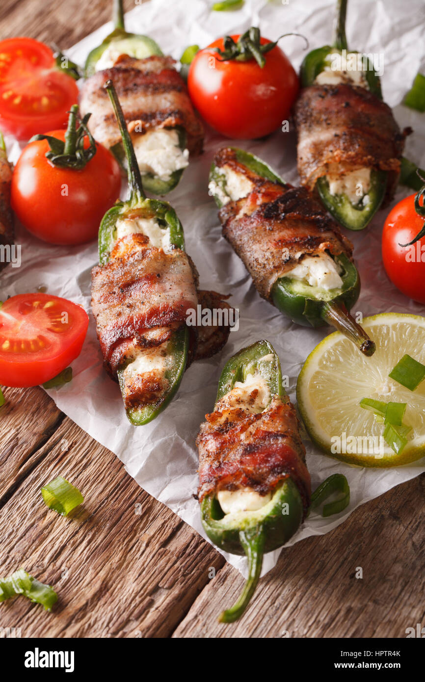 jalapeno peppers wrapped in bacon and stuffed with cream cheese close