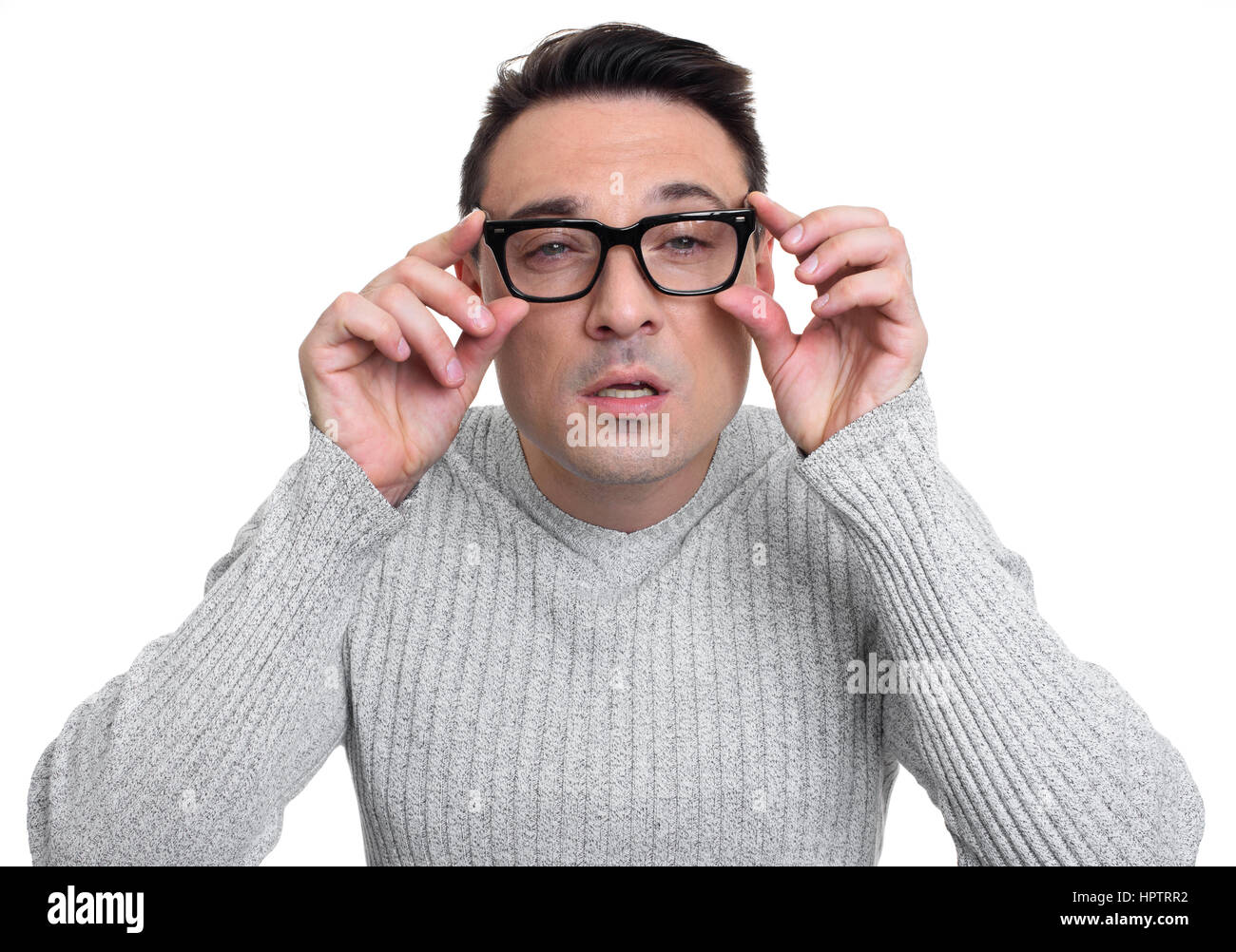 portrait of a concentrate young man wearing glasses. Isolated on white