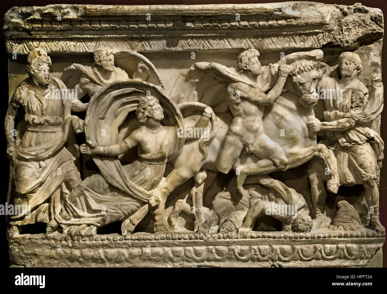 Front of a Cinerary Chest: Dragging of Dirce (  tragedy 'Antiope' by Euripides ) Volterra - Italy, 120-110 BC. ( Dirce  was the wife of Lycus in Greek mythology, and aunt to Antiope whom Zeus impregnated. Antiope fled in shame to King Epopeus of Sicyon, but was brought back by Lycus through force, giving birth to the twins Amphion and Zethus on the way. Dirce hated Antiope and treated her cruelly after Lycus gave Antiope to her; until Antiope, in time, escaped. ) Stock Photo