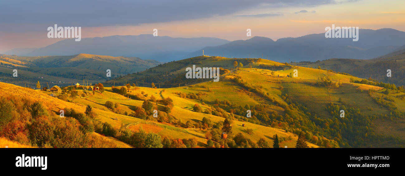 Carpathians orange hills panorama of autumn mountains sky valley Stock Photo