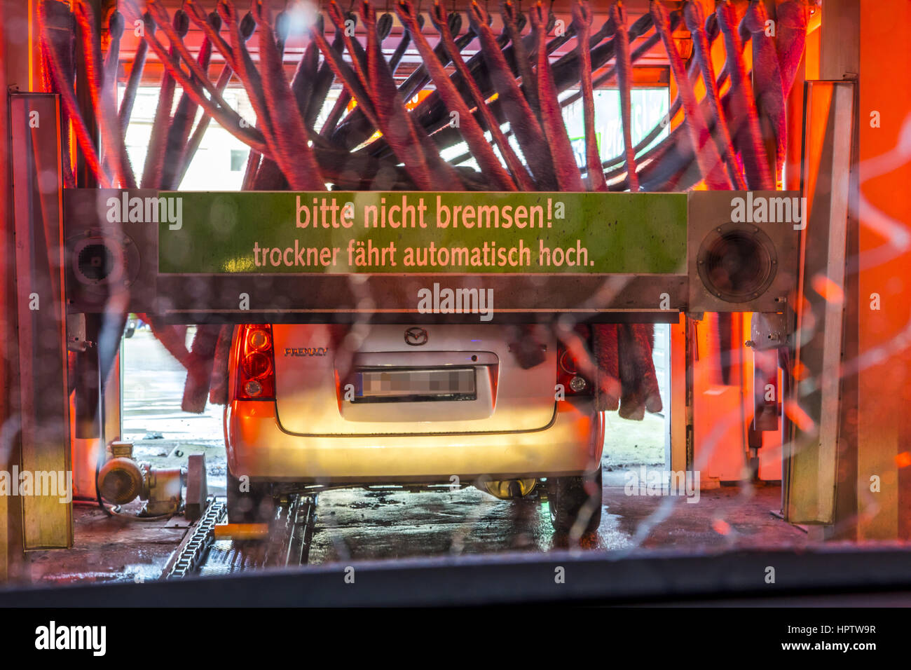 Car in an automatic car wash site, hot air drying plant, rotating