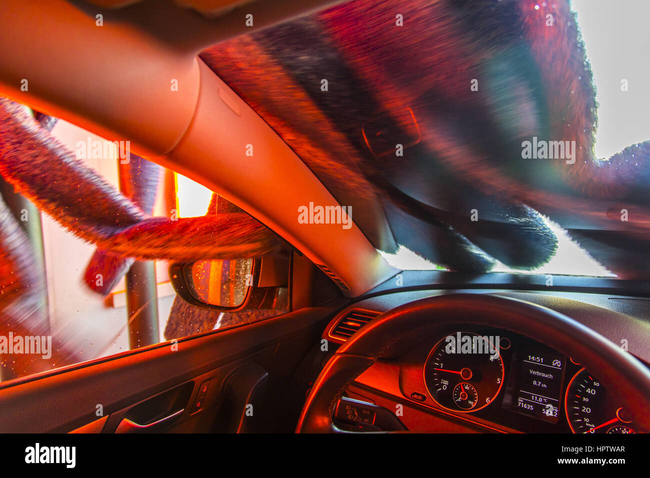 Car in an automatic car wash site, hot air drying plant, rotating