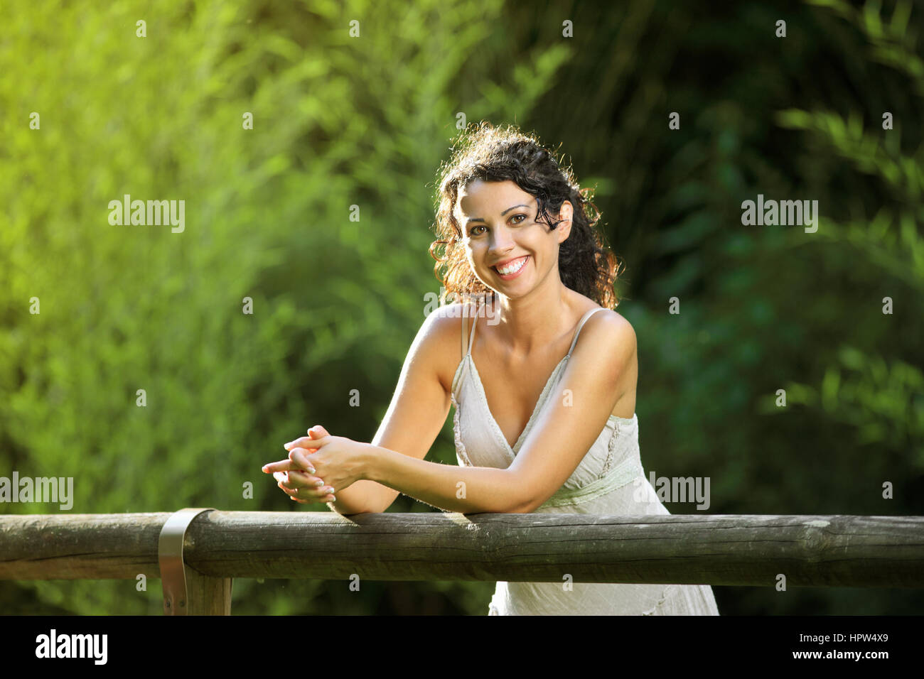 Portrait of a beautiful young woman smiling at camera Stock Photo - Alamy