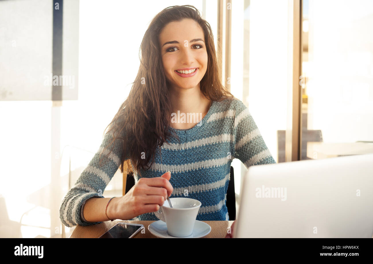 Cheerful girl laptop break hi-res stock photography and images - Alamy