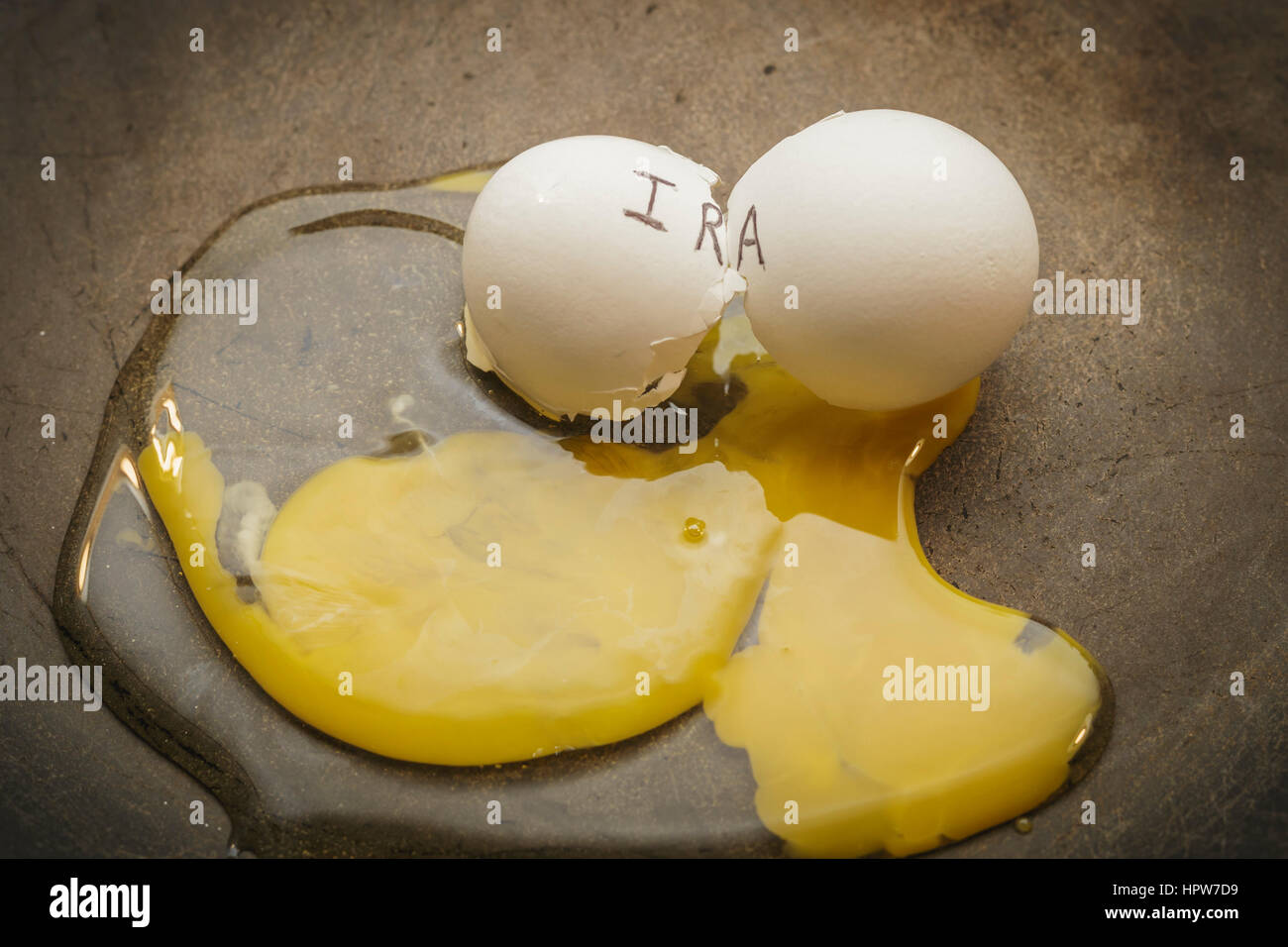 IRA broken nest egg concept Stock Photo