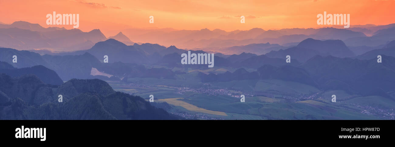 Colorful orange sunset in the alpine mountains Stock Photo