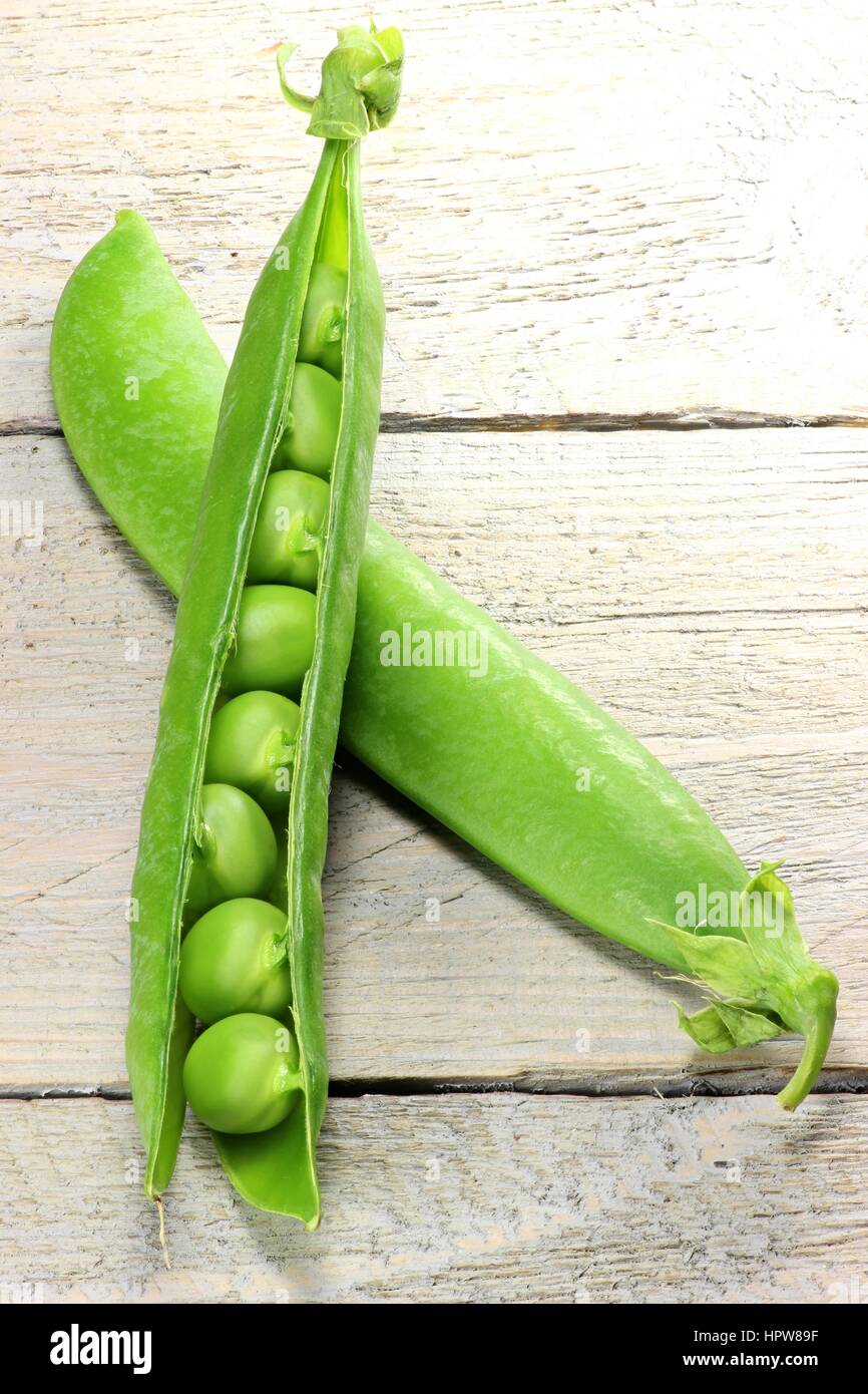 pea pods on wooden background Stock Photo