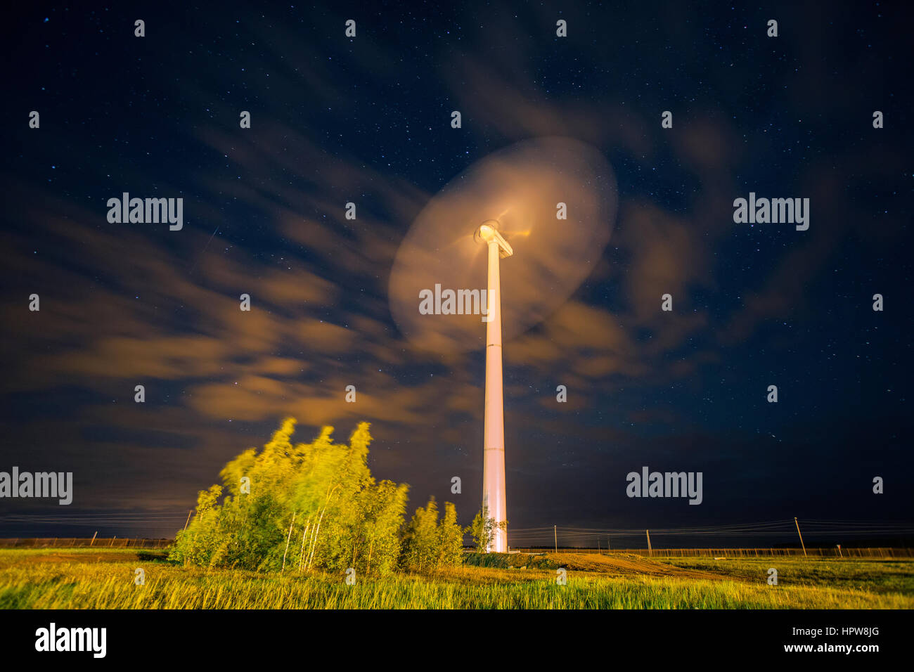 Wind power plant under the sky with stars Stock Photo