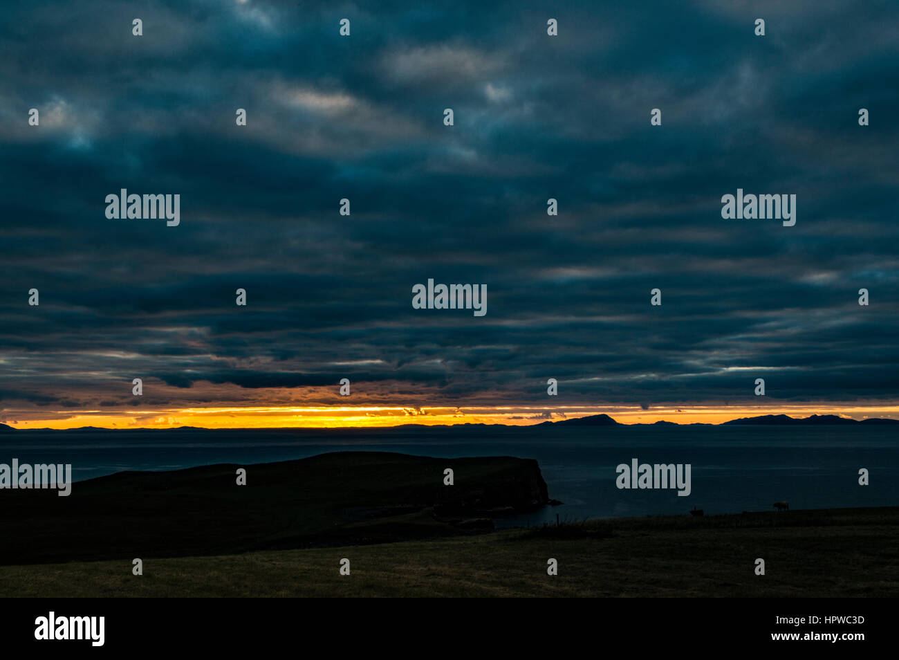 Sunset from Trumpan, on the Waternish Peninsula, Isle of Skye, looking towards the Western Isles, October 2016 Stock Photo