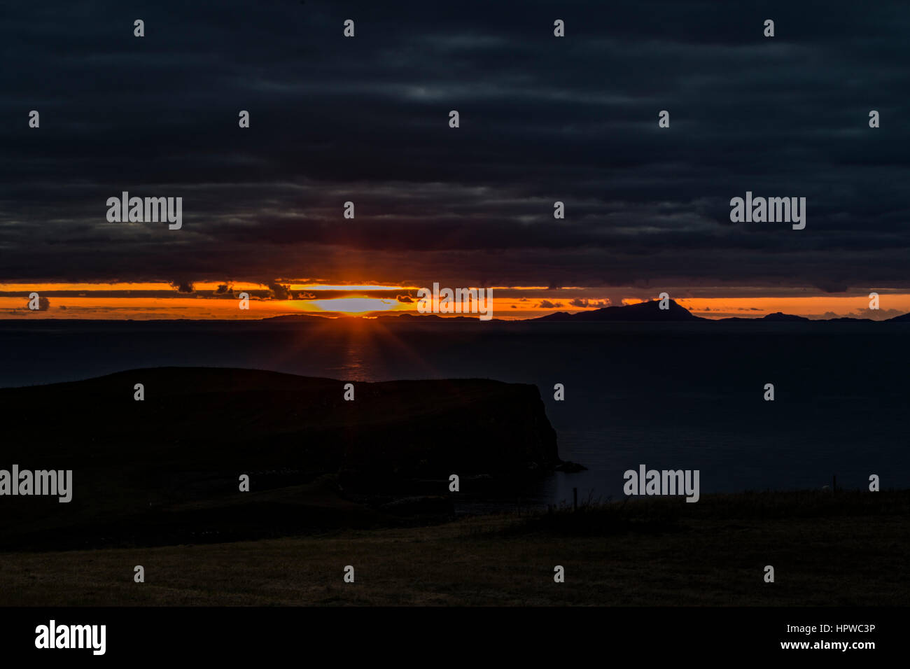 Sunset from Trumpan, on the Waternish Peninsula, Isle of Skye, looking towards the Western Isles, October 2016 Stock Photo