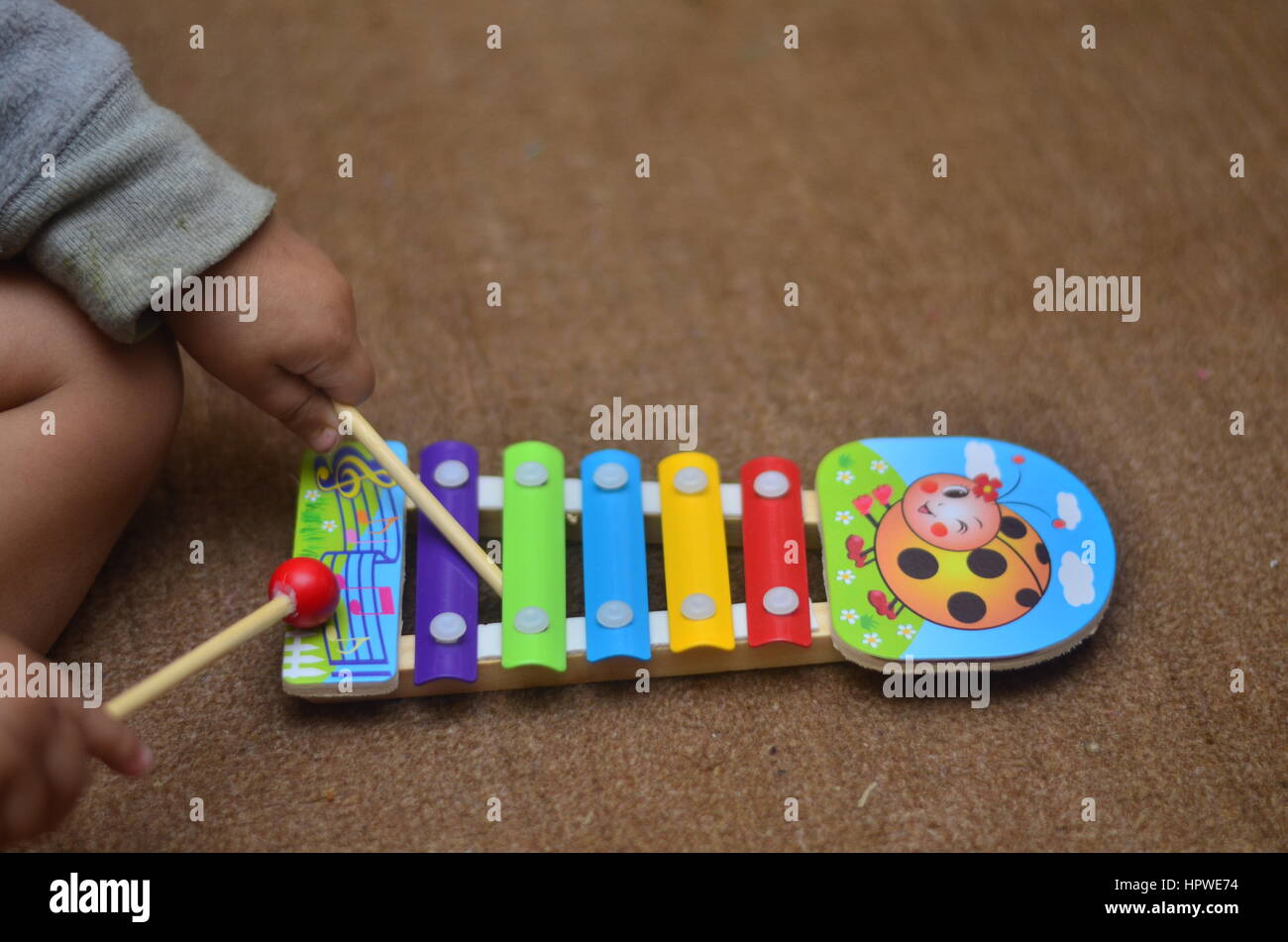 A Baby playing Xylophone Stock Photo Alamy