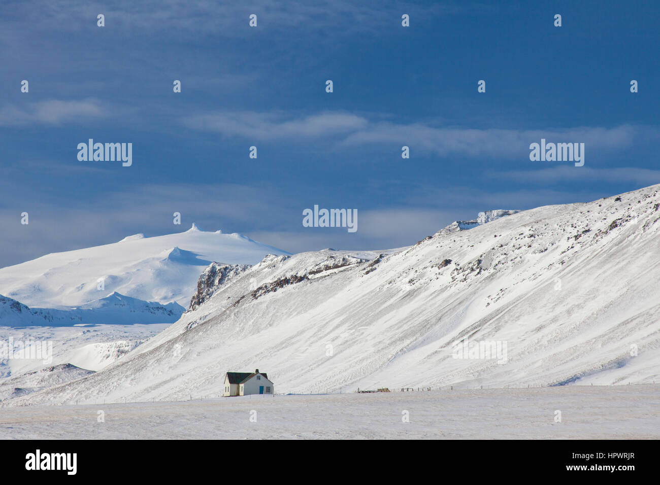 Lonely house in desolate landscape in the snow in winter on the Snæfellsnes peninsula in Iceland Stock Photo