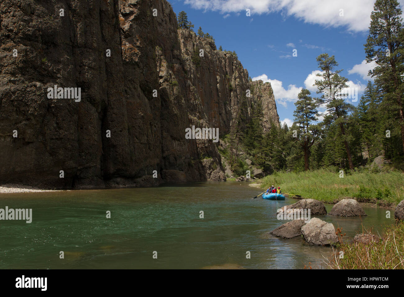 Rafters enjoy a quiet section of the Dearborn River beneath soaring cliffs, Cascade County, MT. Stock Photo