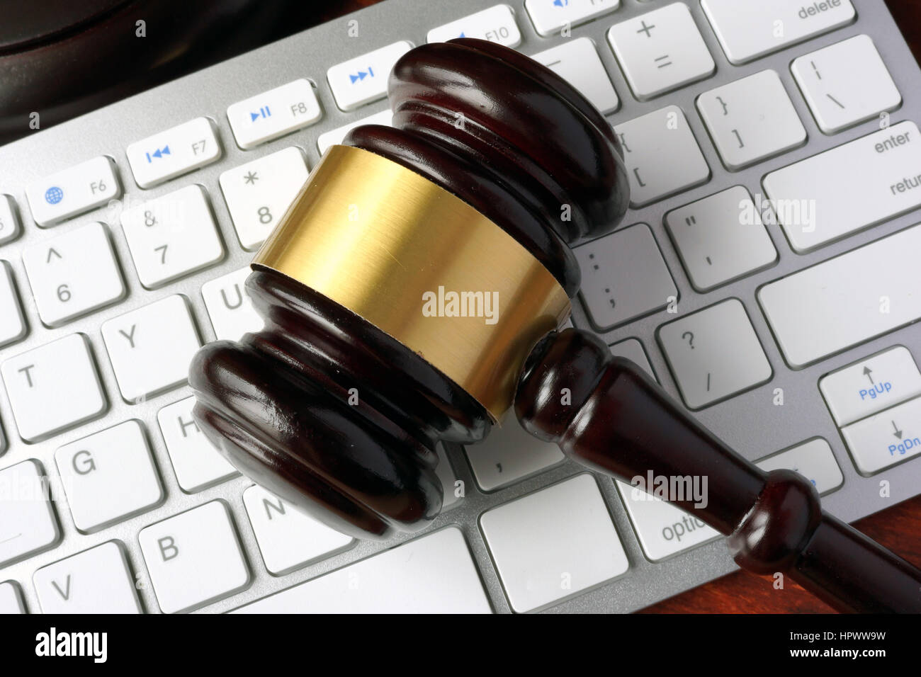 Gavel and keyboard. Internet fraud concept. Stock Photo