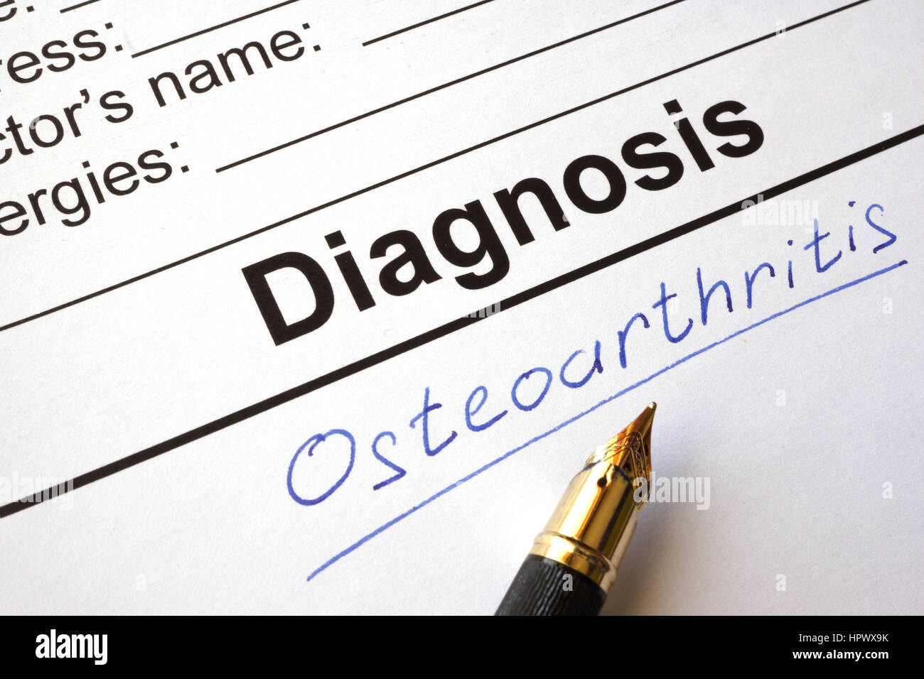 Medical form with diagnosis osteoarthritis on a table. Stock Photo