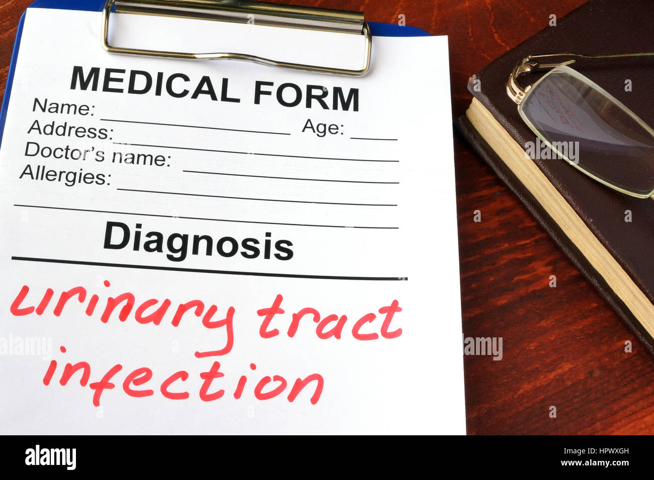 Medical form with diagnosis Urinary tract infection. Stock Photo