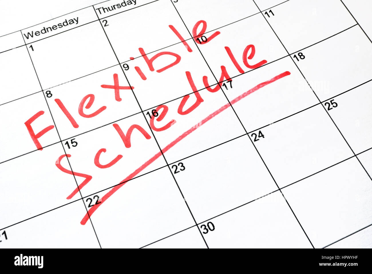 Flexible schedule written on a calendar. Stock Photo