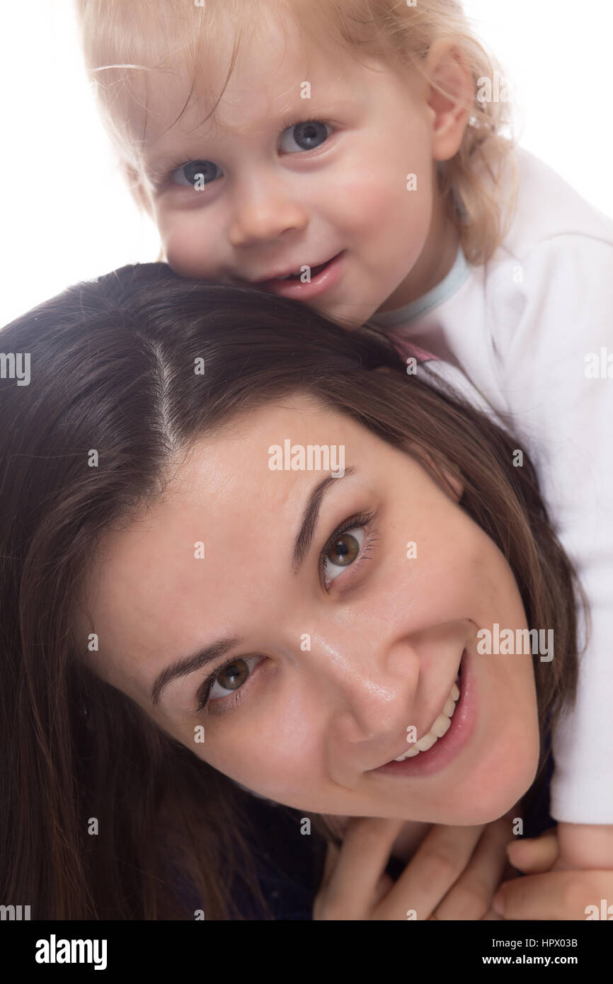 Smiling young mother and her happy child isolated on white Stock Photo