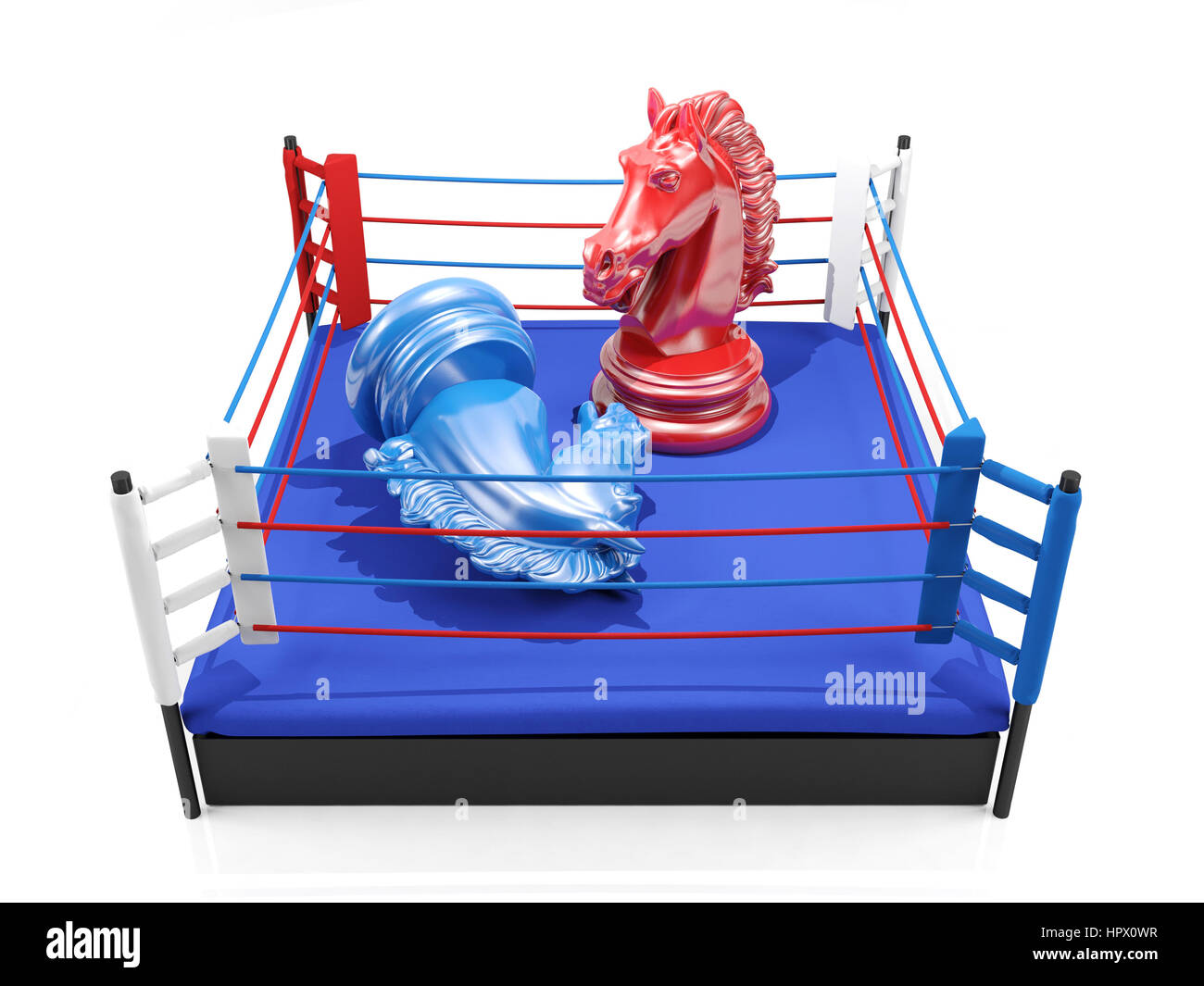 Red chess knight wins over blue chess knight on boxing ring, strategic competition concept Stock Photo