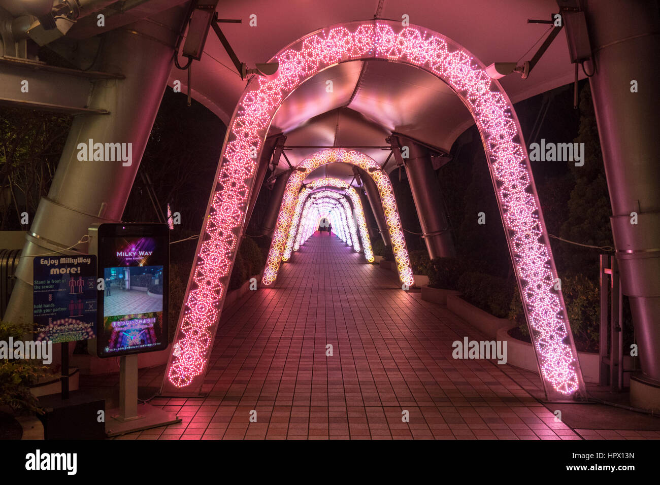 Pink fluorescent lights in a Tokyo City Dome walkway. Stock Photo