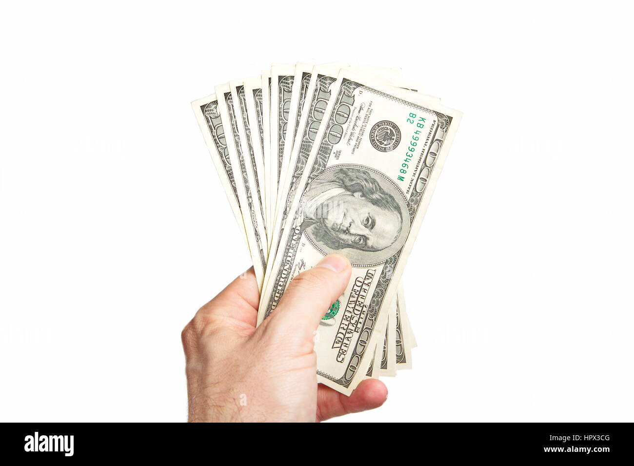 Male hand holding ten bill of hundred dollar isolated on white background Stock Photo