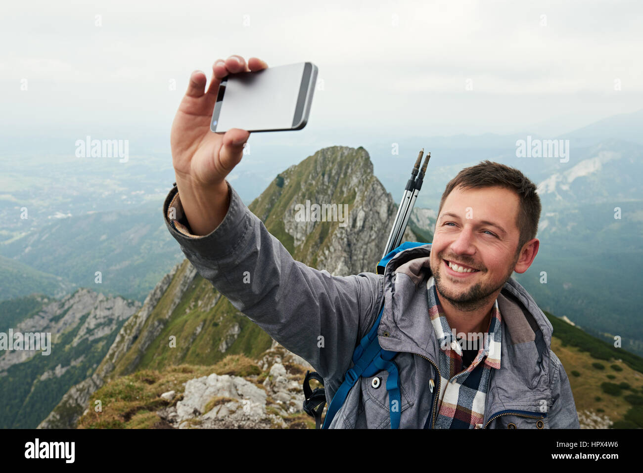 Person taking a selfie in the mountain hi-res stock photography and ...