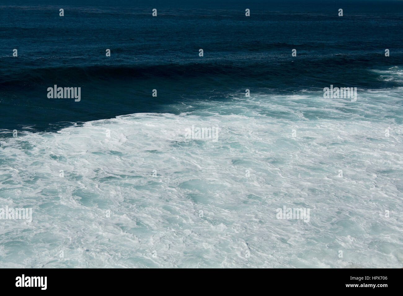 Waves from the Pacific Ocean crash upon the cliffs and shores of La Jolla Cove in San Diego, California. Stock Photo