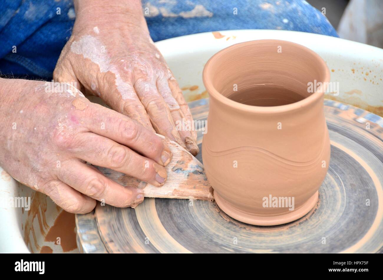Making a Mug on a Potter's Wheel Stock Photo Alamy
