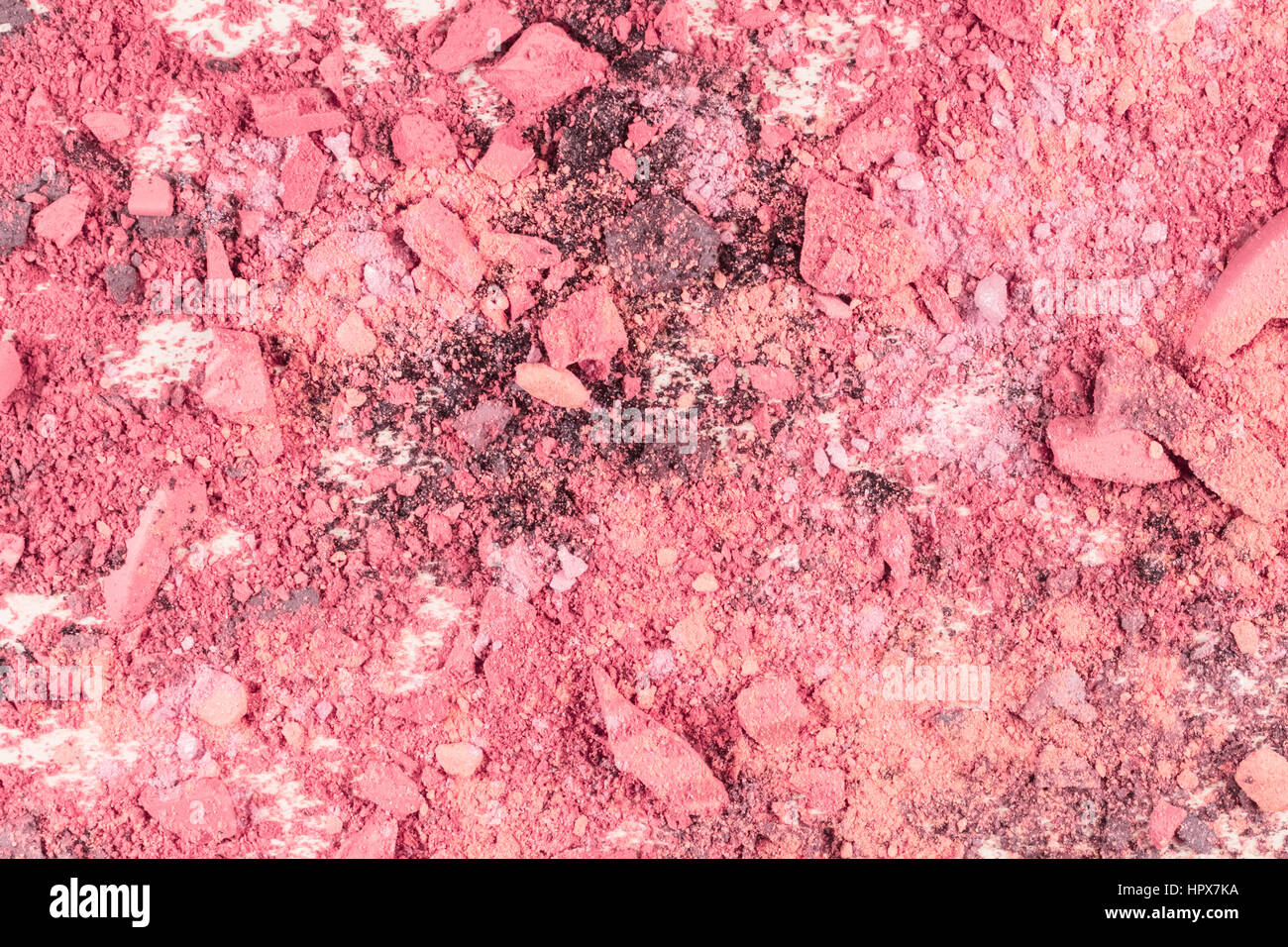 Abstract background texture with vibrant pink makeup powder, shot from above Stock Photo